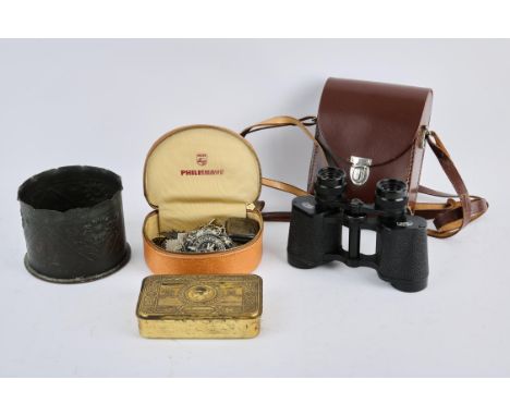 A pair of Carl Zeiss Jena binoculars, a Trench art shell casing dated Arras 1917, a Christmas 1914 tin and cap badges and a s