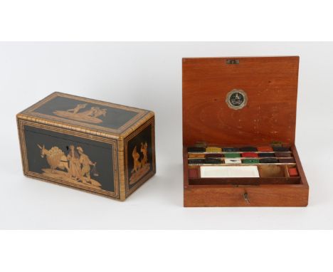 Reeves and Son, an artist's mahogany box, with twenty cakes of water colour paint and a white ceramic mixing palate, with key