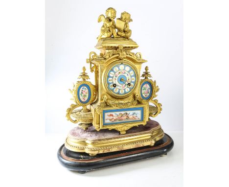 Late 19th century French gilt spelter mantle clock with Serves style porcelain panels and dial, the two train movement striki