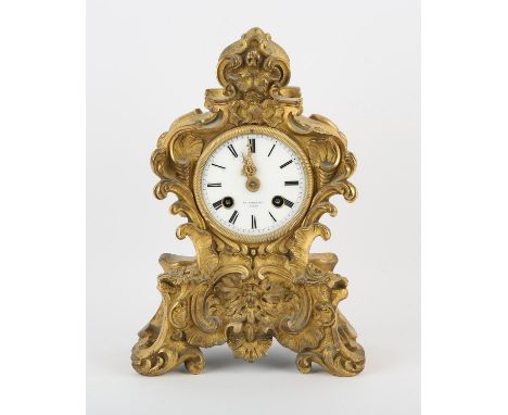 French rococo style ormolu mantle clock the with enamel dial with Roman numerals, signed Hy Phillips. Paris, the two train mo