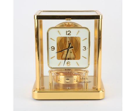 Jaeger-LeCoultre calibre 540 Atmos clock with white square dial and Arabic numerals. Serial no. 649705, in a gilt metal case,