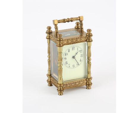 French brass carriage clock, with four finials and baluster and fluted columns to case, enriched with pierced panels of flora