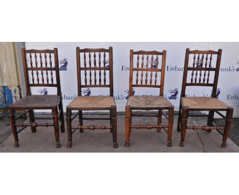 A set of four ash chairs, 19th Century, with bobbin turned arcade back, above woven rush seat, the legs joined with stretcher