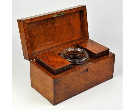 A 19th Century Burr Satinwood finished tea caddy, top opening to reveal twin tea caddies flanking glass tea bowl.