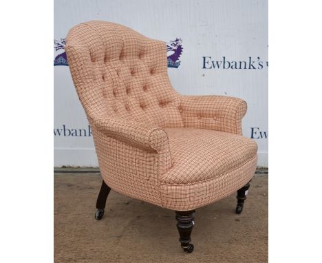 Victorian button backed armchair, upholstered in red and white chequered fabric, on turned legs terminating in casters