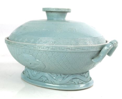 A  light turquoise/blue monochrome oval vessel and domed cover; decorated on the cover with a key-fret pattern beside a mytho