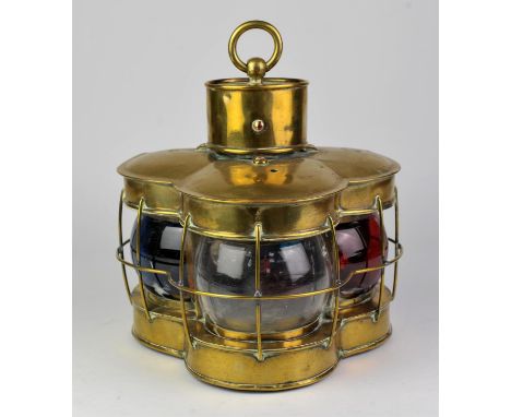 Brass cased three Len's lantern the lenses showing red, clear and blue, hanging handle to top with door to back opening to re
