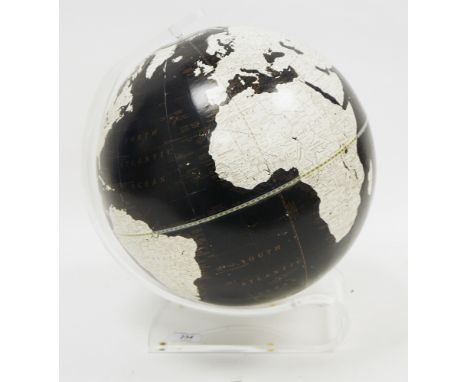 Mid-century Imperial globe by The George F Cram Company, designed with the land masses being white, on a black sea ground, he