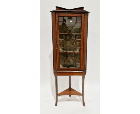 Edwardian mahogany and satinwood inlaid corner display cabinet, the single astragal glazed door opening to a fabric lined int