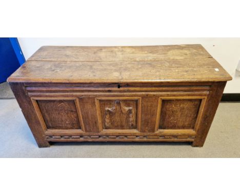 18th century oak coffer, the hinged two-panel top with thumb-moulded front edge, opening to an empty space, over a three-pane