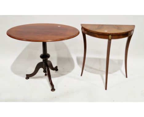19th century mahogany tilt-top table, the oval top on a turned pedestal support with three splayed legs and squat bun feet, 7
