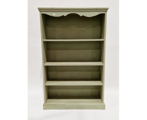 Pine green-painted bookcase with shaped frieze over three fixed shelves, on a plinth base, 149cm high x 95cm wide x 28cm deep