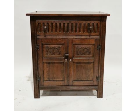 Ercol-style dark elm dresser base&nbsp;comprising a drawer with thumbmould carving over two carved panel cupboard doors with 