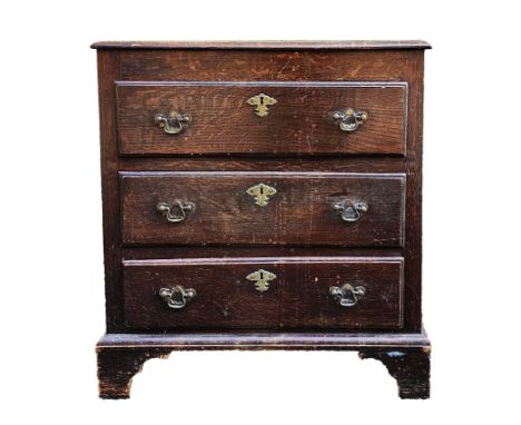 19th century oak chest of drawers&nbsp;with three long drawers with engraved brass escutcheons, on ogee bracket feet, 81cm hi