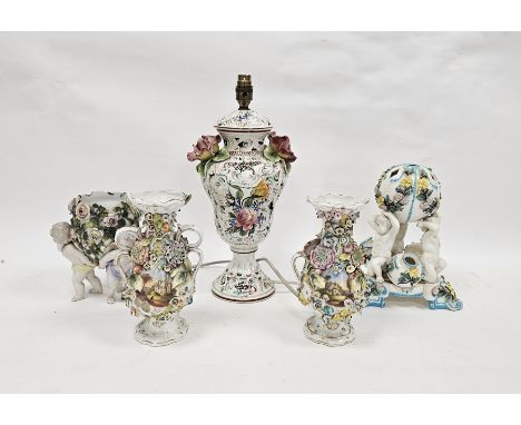Pair of English porcelain Coalbrookdale-type vases, circa 1835, of baluster form, flower encrusted and painted with buildings