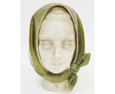 Mid century ceramic bust in the form of a woman wearing a green headscarf with disc-shaped eyelashes, indistinctly signed to 