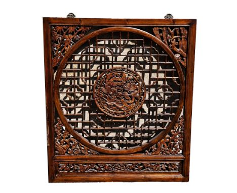 Chinese carved hardwood and pierced screen, wall-mounting, square and centred by carved dragon, flaming pearl and ho-ho bird,