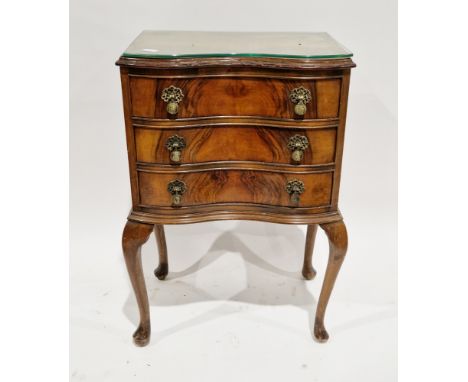 Early 20th century walnut&nbsp; bedside cabinet of serpentine form in the Queen Anne manner, the top with carved moulded edge