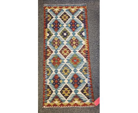 Chobi Kilim cream ground runner&nbsp;with two rows of four lozenges and one row of five flanked by single geometric border 14