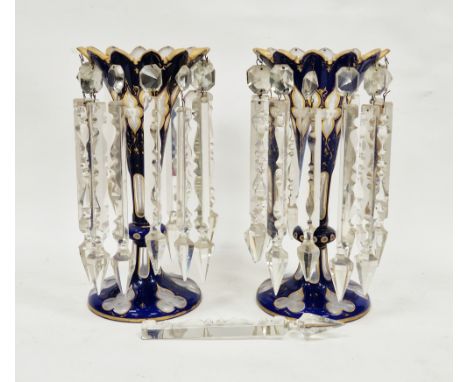 Pair of 19th century Bohemian blue overlay and clear glass table lustres with gilt decoration and prismatic crystal drops, 31