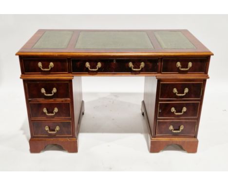 Mahogany-effect twin pedestal desk by Abbeycraft International, the rectangular top with three green leather inset writing su