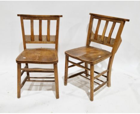 Pair of 19th century beechwood and elm chapel chairs, each with slatbacks having prayer book troughs to rear, on turned legs 