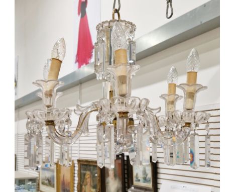 Gilt metal and glass six-branch electrolier, the scrolling branches having double sconces in the form of flowers, attached wi