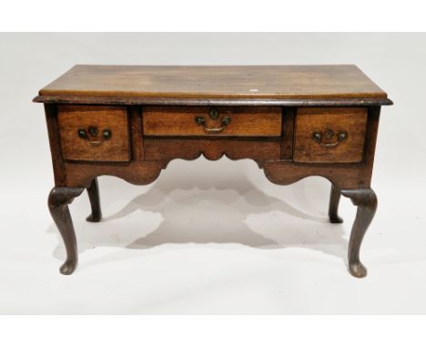 18th century oak dresser base, the rectangular top with deep thumbmoulded edge, over three frieze drawers with thumbmoulded e