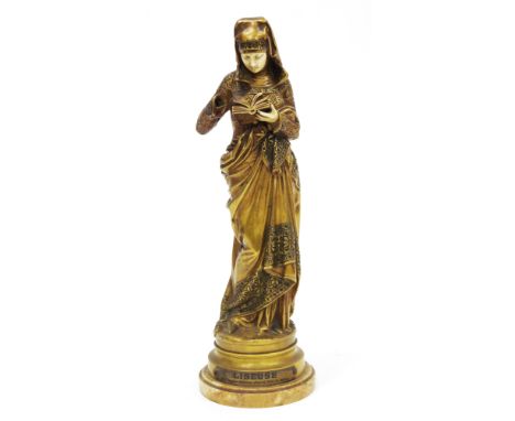 Albert Ernest Carrier-Belleuse (1814-1887), gilt bronze figure, La Liseuse, a standing woman dressed in a draped gown with he