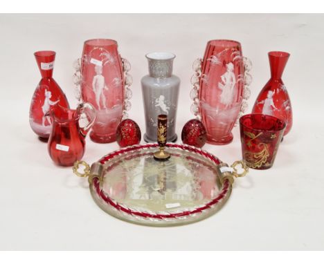 Two pairs of Mary Gregory-style cranberry coloured vases, circa 1900, the first oviform with crimped ornament, enamelled in w