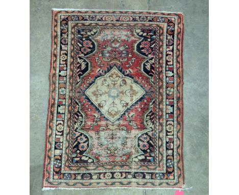 Eastern red ground rug&nbsp;with central hooked floral lozenge on floral pattern field, multiple geometric and floral borders