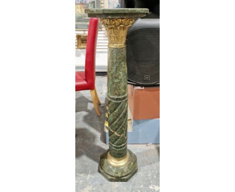 Late 19th/early 20th century green marble torchere, the octagonal top on a turned column support with gilt metal capital, on 