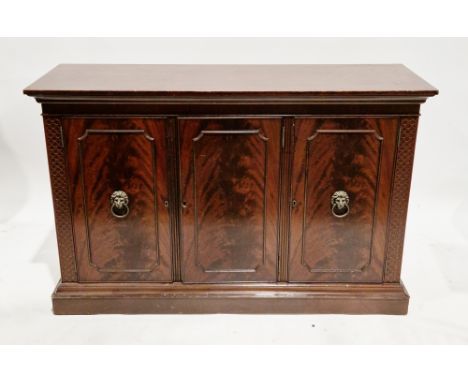 Mahogany sideboard in the George III manner comprising three panelled cockbeaded cupboard doors opening to a shelf and three 