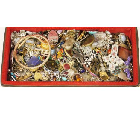 Two wicker sewing baskets containing a large quantity of costume jewellery including brooches, pendants and necklaces