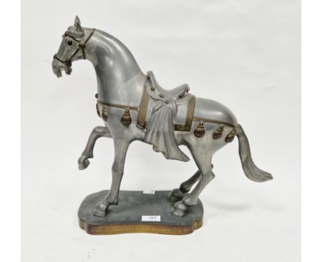 Contemporary Hong Kong pewter and brass model of a Tang-style horse, wearing a saddle and bridle cloth, on a shaped rectangul