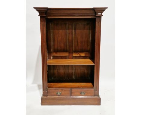 Hardwood bookcase in the Regency manner, having a moulded top, reeded column sides, single adjustable shelf with two drawers 