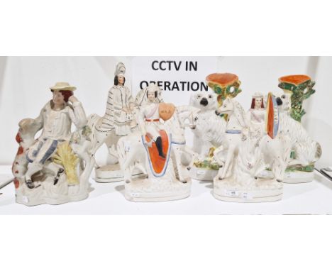 Collection of 19th century Staffordshire pottery figures, comprising equestrian figures of War and Peace, a farmer seated wit