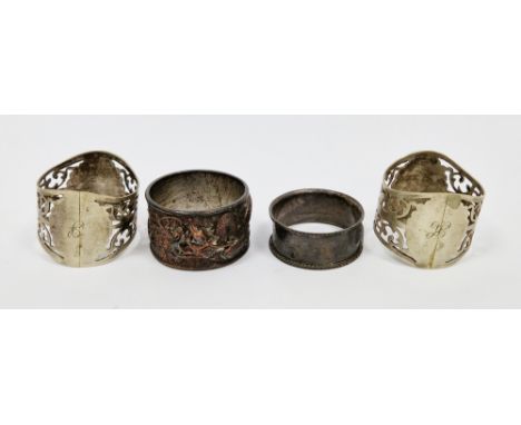 Victorian silver napkin ring, a pair of pierced silver plated napkin rings and a Chinese metal dragon cast napkin ring,&nbsp;