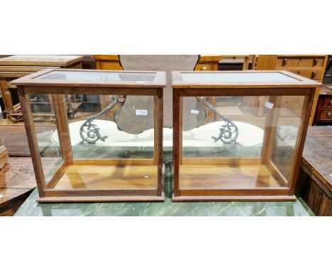 Pair of early 20th century mahogany balance scale cases&nbsp;with glazed panels to five sides and back slide up doors, each c