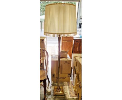 Brass standard lamp, the turned and reeded column on a square base with beaded edge, with shade, 160cm high&nbsp;