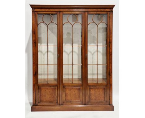 Bevan &amp; Funnell burr walnut display cabinet, the three part astragal glazed and part panelled doors opening to an interio