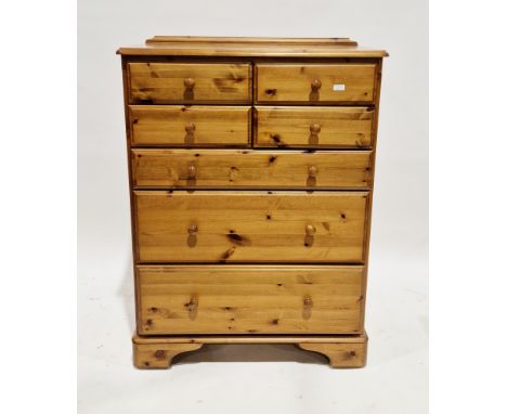Modern Ducal pine chest of drawers&nbsp;comprising four short drawers over three long graduated drawers, each with a turned p