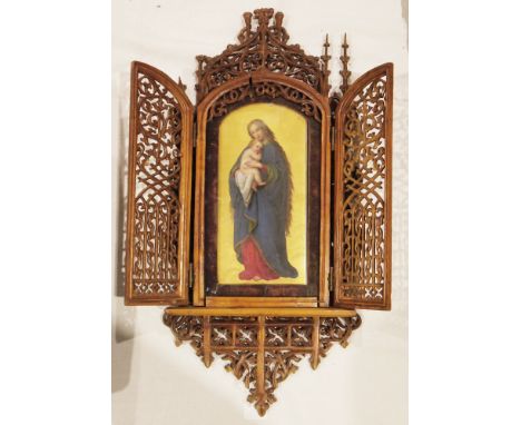 19th century wood and porcelain icon, the gothic walnut pierced carved frame having two doors opening to a painted porcelain 
