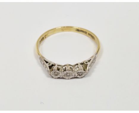 18ct yellow gold and diamond ring, comprising a row of three illusion-set round diamonds on a platinum head, size W, 3.0 gram