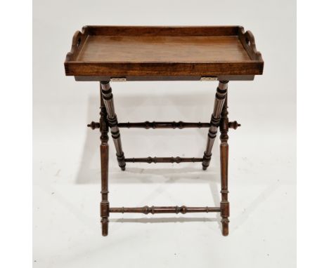 19th century butler's tray on stand, the tray with pierced integral handles, the folding stand with turned fluted supports, 8