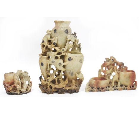 Three 20th century Chinese carved soapstone vases&nbsp;or brush pots, the largest carved with three conjoined vases and with 