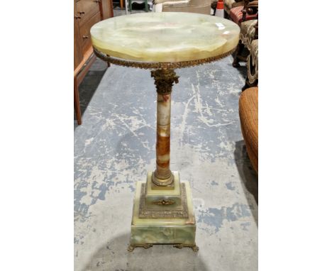 19th century French onyx lamp table of jardini&egrave;re stand, the circular top with gilt metal frieze on a pedestal support