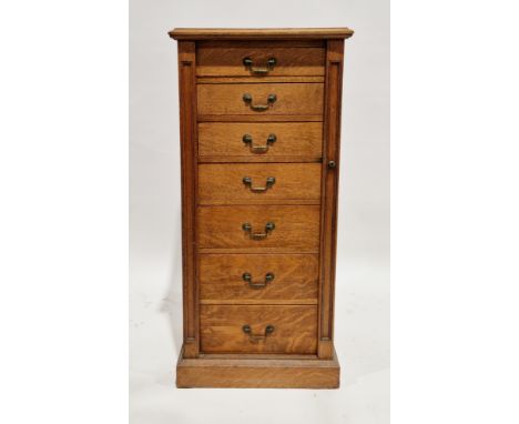 19th century golden oak Wellington chest, the top with thumbmoulded edge over seven graduated drawers with brass swan neck lo