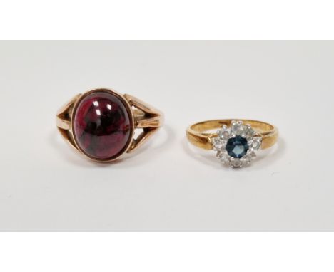 9ct yellow gold ring set with an oval cabochon garnet, 1.3cm long, with pierced shoulders, size S 1/2, 6.1 grams together wit