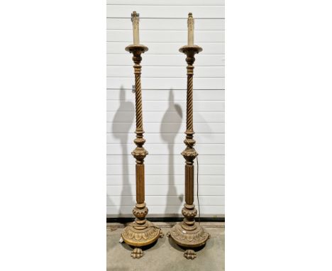 Pair of early 20th century giltwood standard lamps, the turned baluster columns with barleytwist and fluted decoration, on ci
